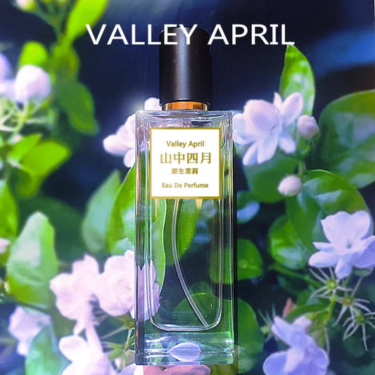 Valley April 山中四月 Wild Jasmine EDP — glass bottle held against flowering jasmine garden