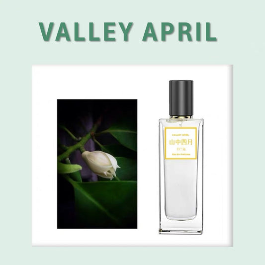 Valley April 50ml bottle beside white orchid bud — Eastern botanical perfume, pure and unhurried