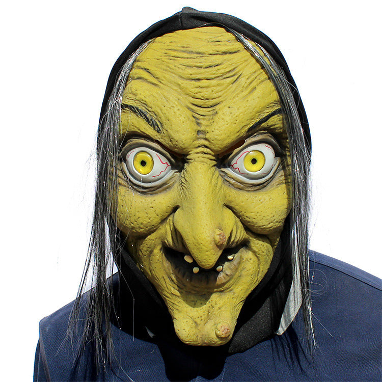 Latex witch mask full face close-up — unnerving yellow eyes and hand-finished skin texture detail